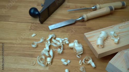 Carpenter's workbench planks, tools  and wood shavings.   Woodworking and carpentry concept.
