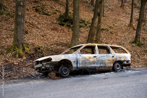 Charred car on the way out of the forest