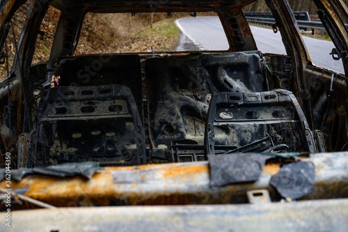 Charred car on the way out of the forest