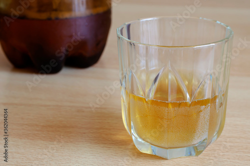 Close-up of unfinished beer in a glass. photo