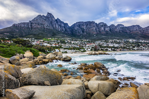 Wonderful Camps Bay nature (Kampsbaai) before sunset - affluent suburb of Cape Town. Camps Bay bordered by spectacular Twelve Apostles Mountain and glittering Atlantic Ocean. Camps Bay, South Africa.