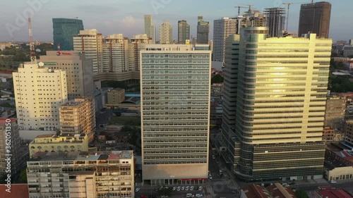 Luanda skyline from above, capital of Angola. Aerial footage, pan out during the sunset hour