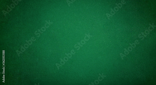 Poker table felt background in green color photo