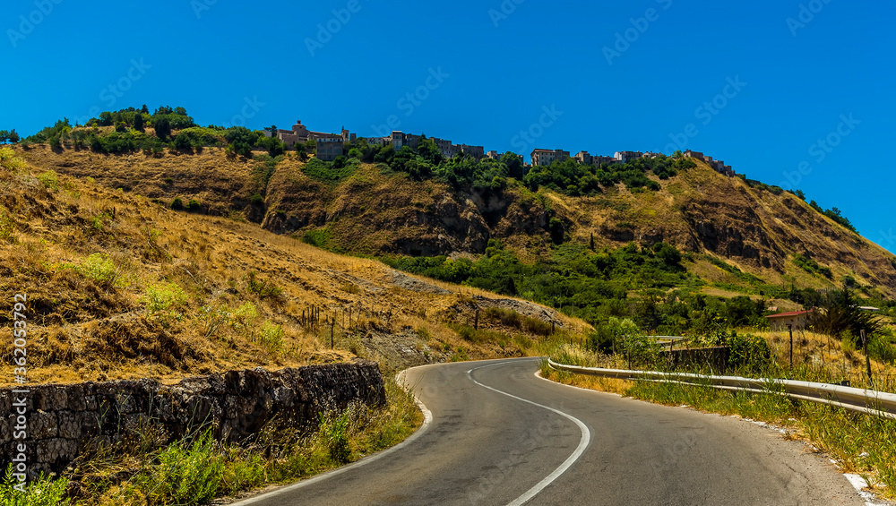 The road leading up to the hilltop settlement of Polizzi Generosa in the Madonie Mountains, Sicily in summer