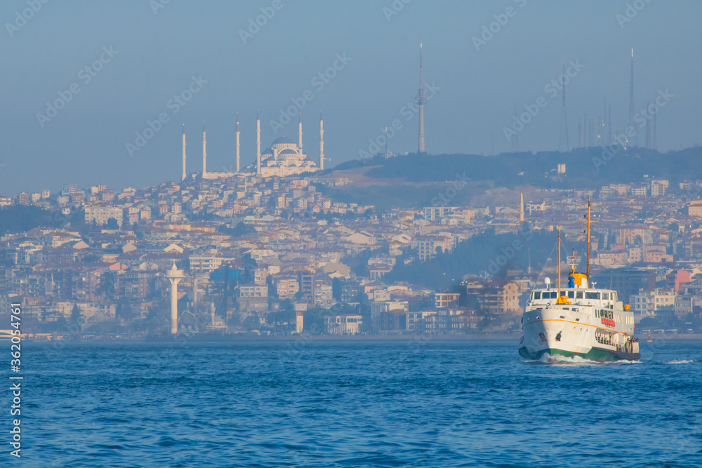 Ferry and Camlica Mosque in Istanbul