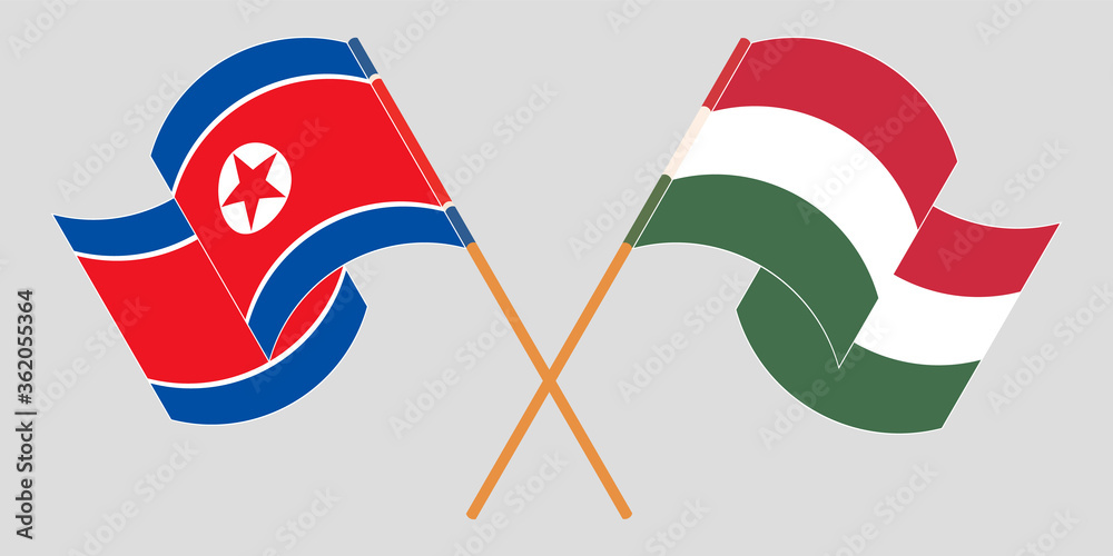 Crossed and waving flags of North Korea and Hungary Crossed and waving flags of North Korea and Hungary