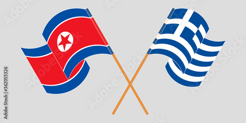 Crossed and waving flags of North Korea and Greece