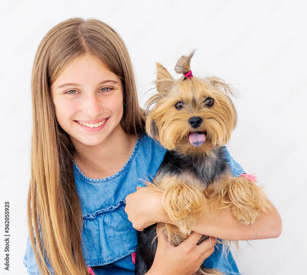 Portrait of cute girl holding terrier dog Portrait of cute girl holding terrier dog