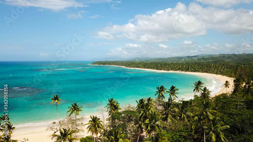 Las beach in Las Terrenas, Samaná Peninsula, Dominican Republic. Paradise beach with coconut trees in Central America photo