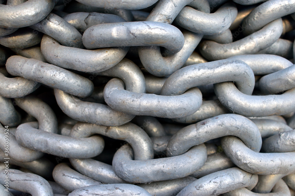 Old industrial chain ropes - the big chains (silver color) close-up Old industrial chain ropes - the big chains (silver color) close-up