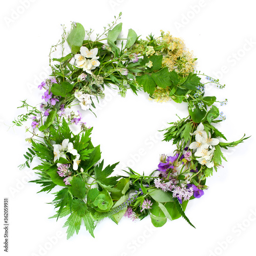 Beautiful flower wreath with colorful flowers isolated on a white background. Midsummer celebration concept, summer decoration.