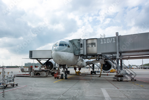 Loading of the aircraft jet at the airport in summer.