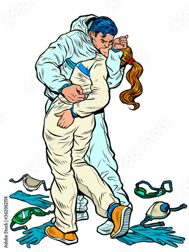 kiss of victory over coronavirus. people in medical protection suits