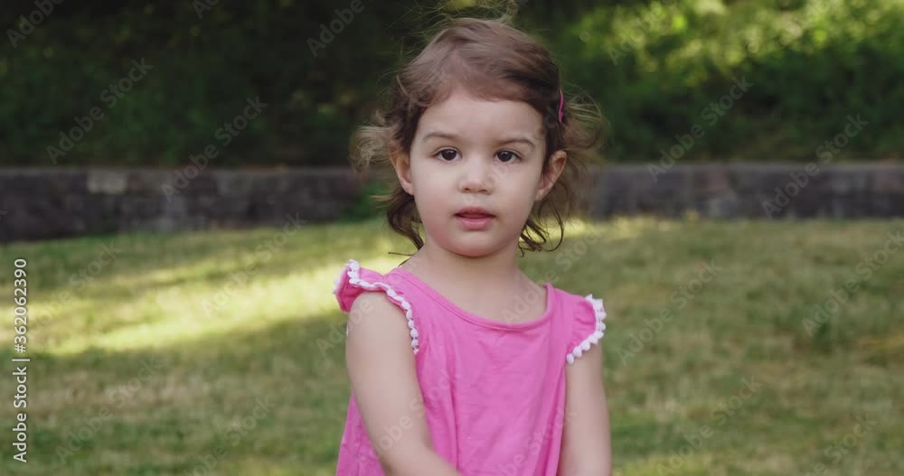 Cute toddler baby girl enjoying the park in summer. Real life footage. Shot in 4K. Cute toddler baby girl enjoying the park in summer. Real life footage. Shot in 4K.