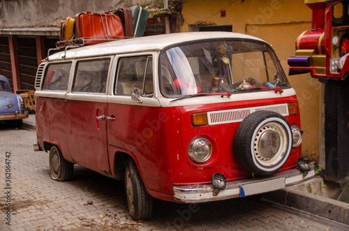red car in front of a house
