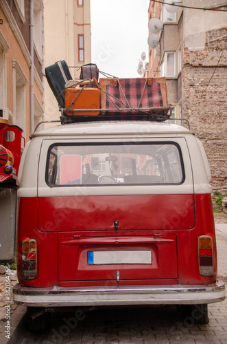 red car in front of a house
