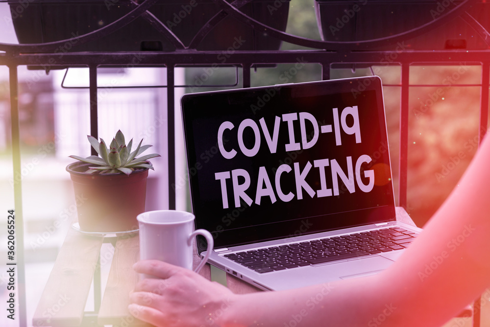 Text sign showing Covid 19 Tracking. Business photo text Distinguishing process of the possible infected individuals Personal workplace overview with laptop device used for individual interest - obrazy, fototapety, plakaty 