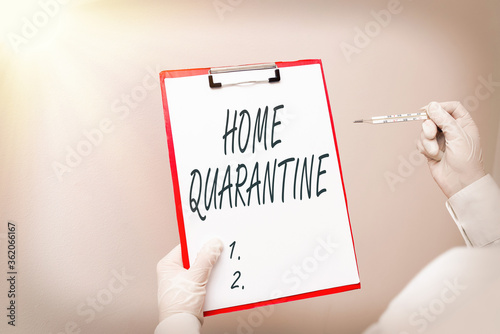 Writing note showing Home Quarantine. Business concept for Encountered a possible exposure from the public for observation Laboratory blood test sample for medical diagnostic analysis photo