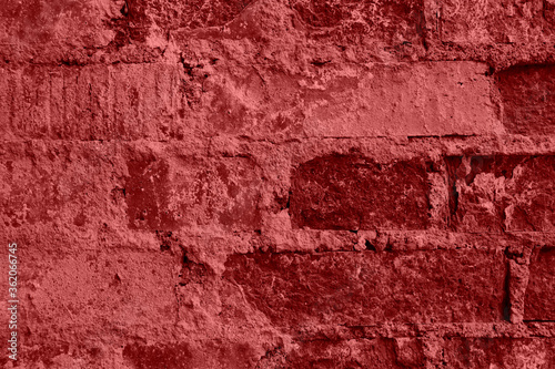 Closeup shot of wall of red old bricks with crack cement