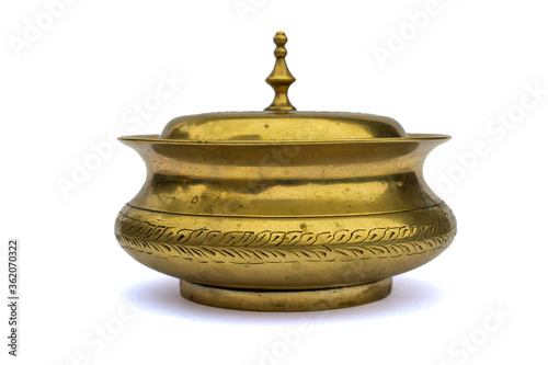 Old clay / copper / bronze pot / bowl with ornamental engraving  and lid isolated on white studio background
