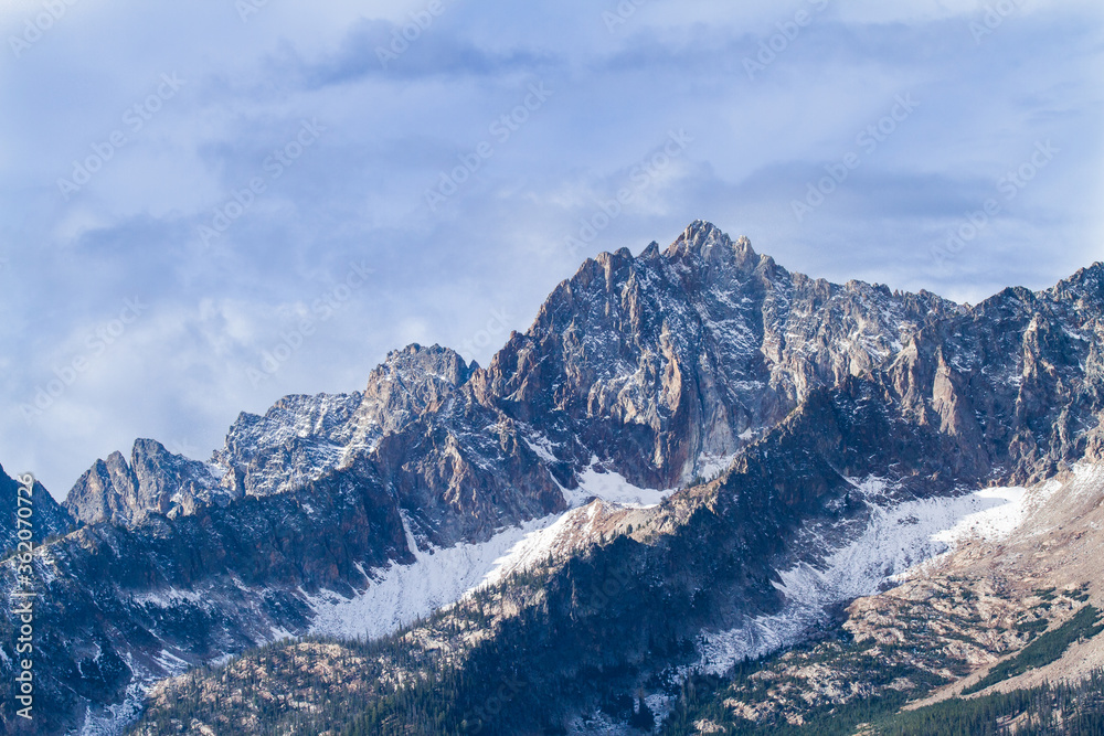 the Sawtooth mountains in the fall season with an early snow near Stanley, Idaho.
