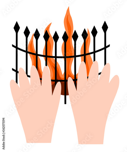 hands are warming by the fireplace. cozy time. burning fire in the fireplace. Hugge.