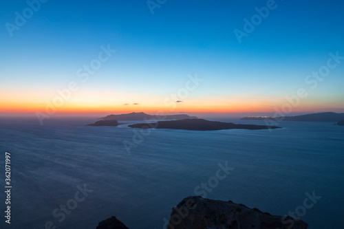 Fototapeta Naklejka Na Ścianę i Meble -  Sunset over Caldera on Santorini island in Greece.