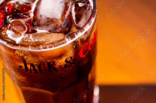 Coke with jack Daniel's of Brazil on wooden background. May, 2019, Ribeirao Preto, Brazil