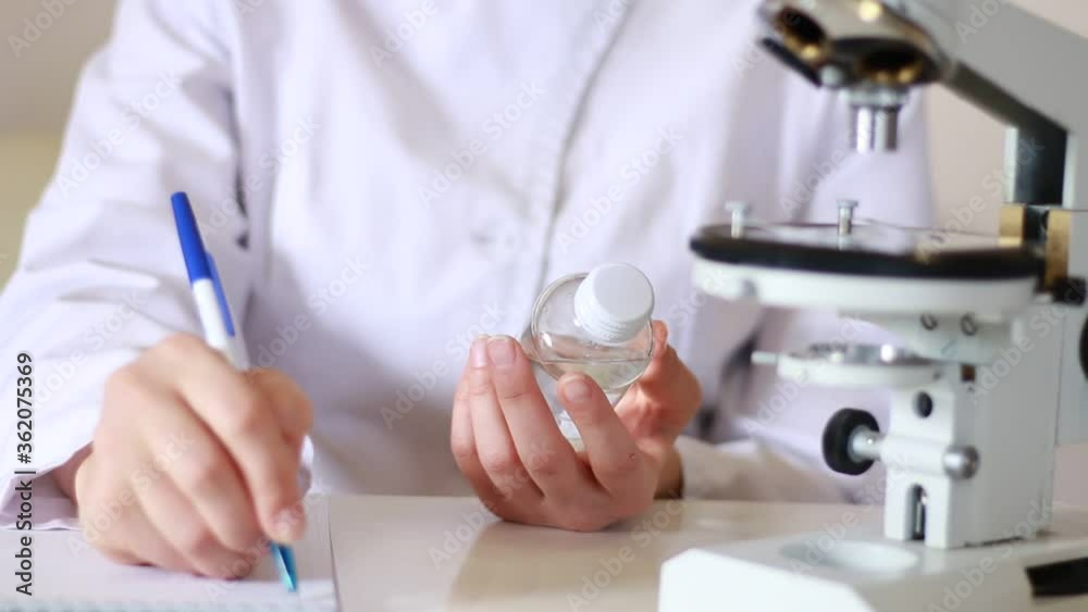 Doctor makes notes in the laboratory. Doctor makes notes in the laboratory.