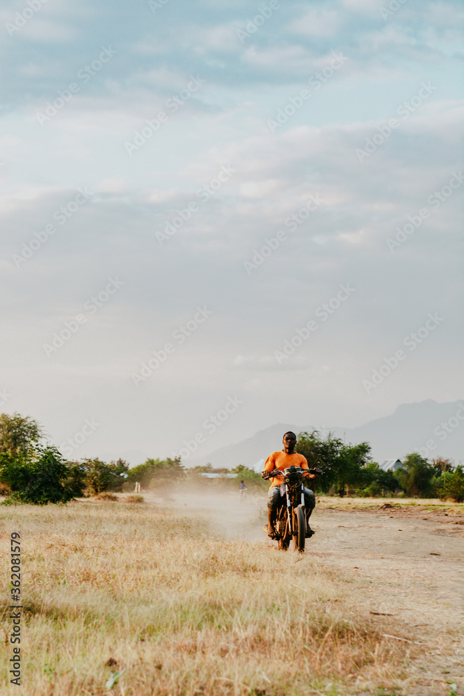 Obraz premium a man riding a bike i