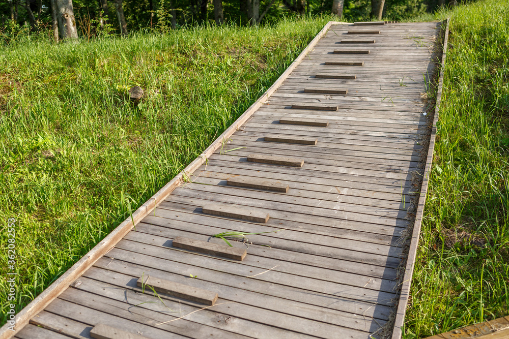 Wooden sidewalks on the grass