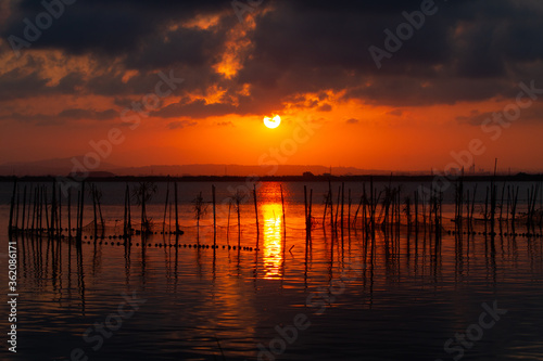 Sunset over Albufera freshwater lagoon and estuary on the Gulf of Valencia coast, Spain