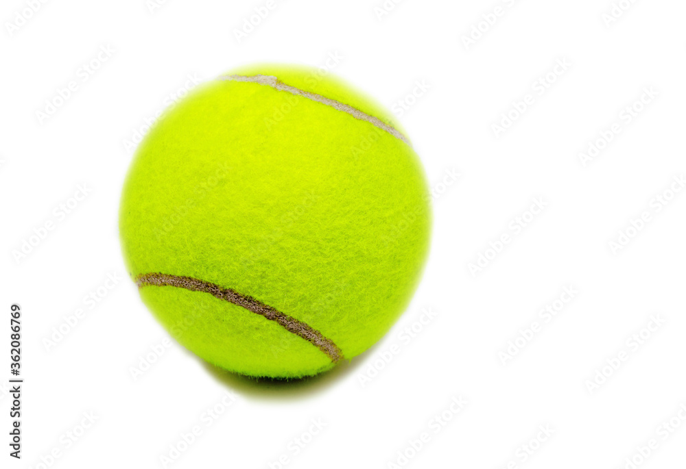 Yellow tennis ball on white background. Single felt ball with dark curve line and small shadow. Tennis game equipment.