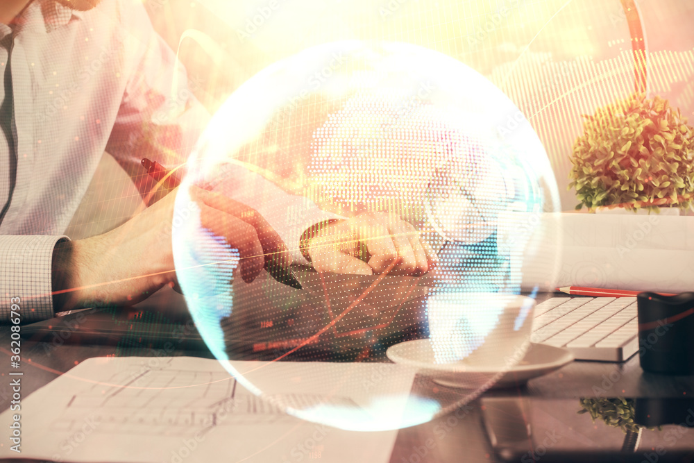 Double exposure of man's hands holding and using a phone and international business theme drawing. Double exposure of man's hands holding and using a phone and international business theme drawing.
