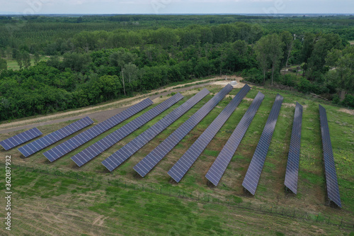 Aerial view of the huge solar power plant. Alternative clean green energy using renewable solar energy. Drone photo Solar panels in Europe  Hungary.