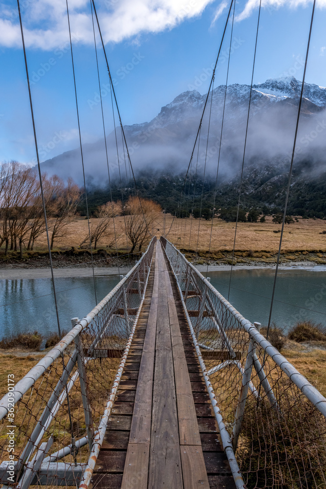 Swing footbridge across the Matukituki river New Zealand