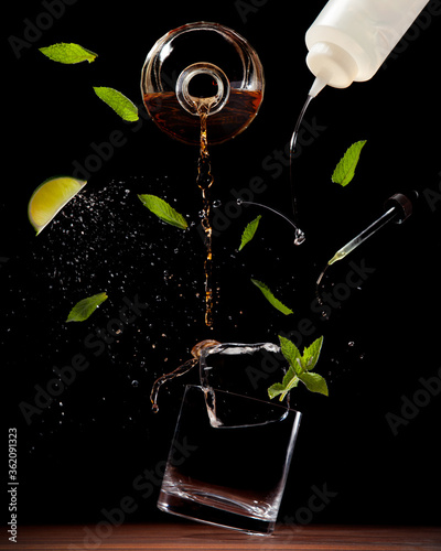 Exploded view of a cocktail on a dark background photo