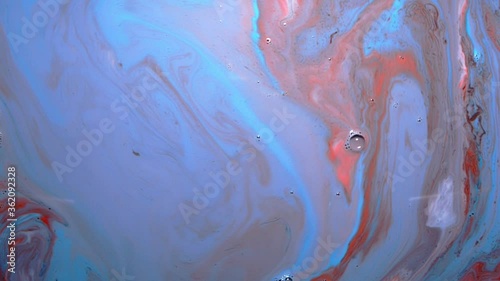 Abstract red and blue background or wallpaper for screen, blue and red food coloring twisting together