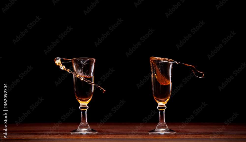 2 shots of cognac splashing