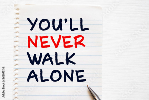 фотографія You'll never walk alone concept on brown envelope