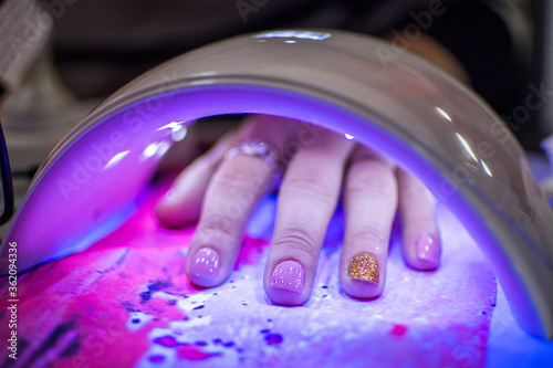 nails inside a led uv booth