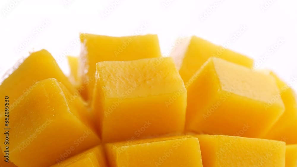 Ripe Slide of mangoes on white background. Ripe sliced mango squared rotation in 4k slow motion Ripe Slide of mangoes on white background. Ripe sliced mango squared rotation in 4k slow motion