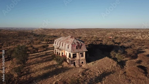 4K aerial drone video of Africa savanna hills, plains and abandoned dilapidated old colonial mansion near Neuheusis west of Windhoek in central highland Khomas Hochland of Namibia, southern Africa photo