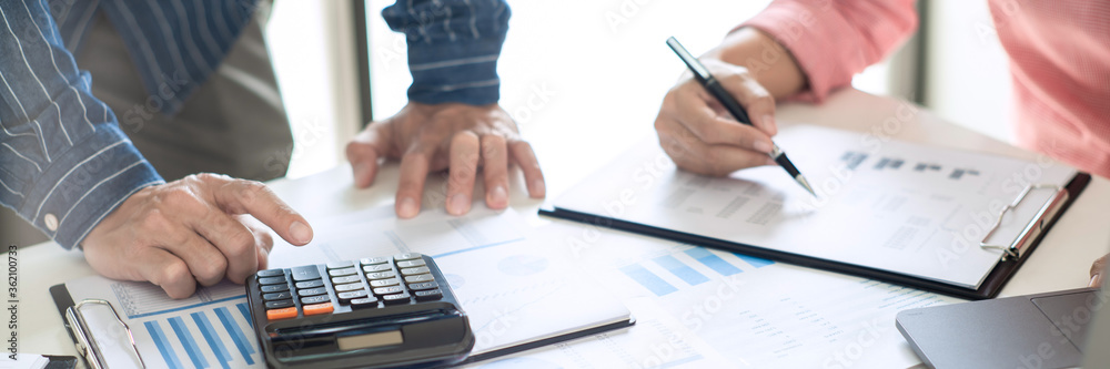 Business team working with plan on office desk with new startup project analysing financial document data
Business team working with plan on office desk with new startup project analysing financial document data