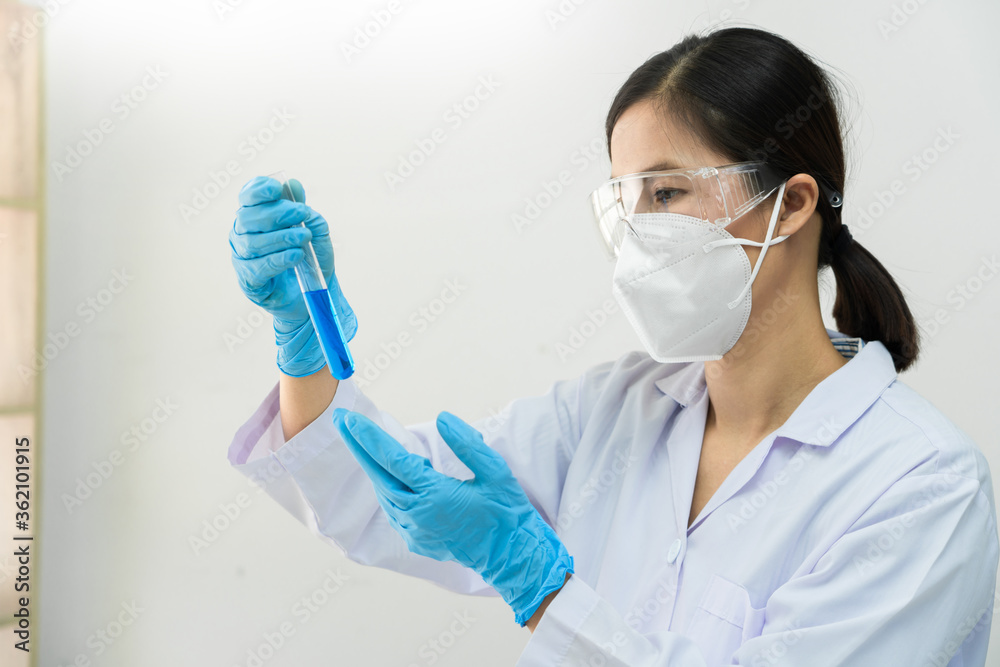 Asian scientist doing research for analyzing a Experiments sample in laboratory. Asian scientist doing research for analyzing a Experiments sample in laboratory.
