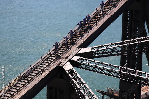 Photography Aerial view of People climbing and explore Sydney Harbor Bridge with  cityscape