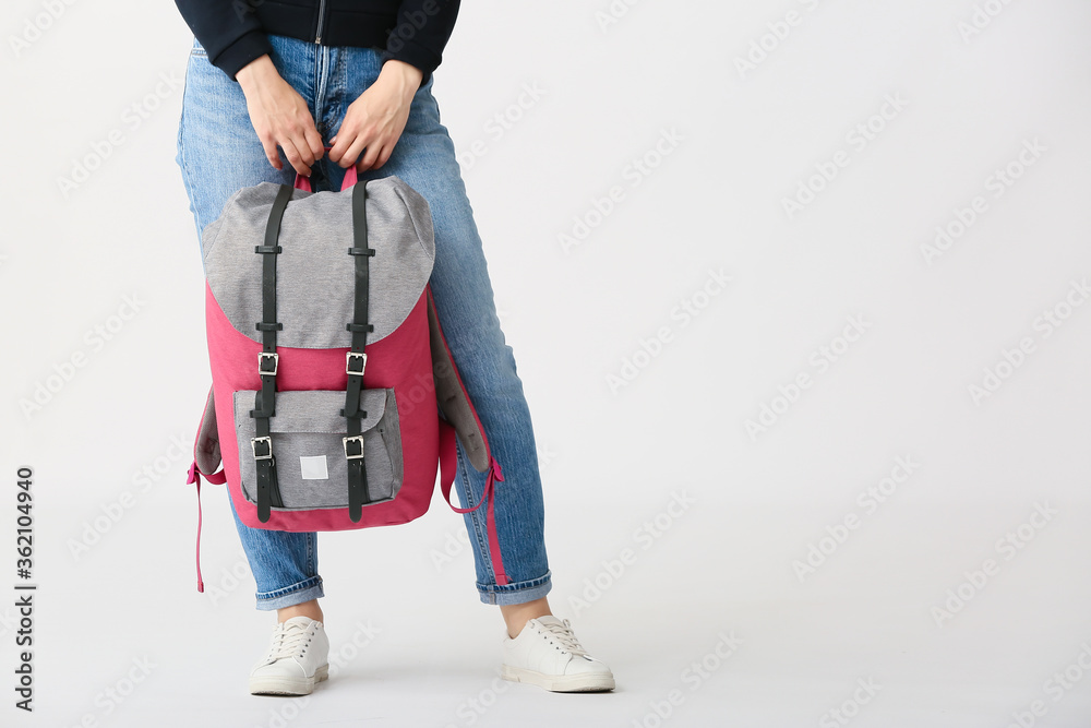 Young woman with backpack on white background Young woman with backpack on white background