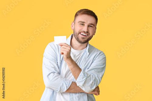 Young man with blank busine...