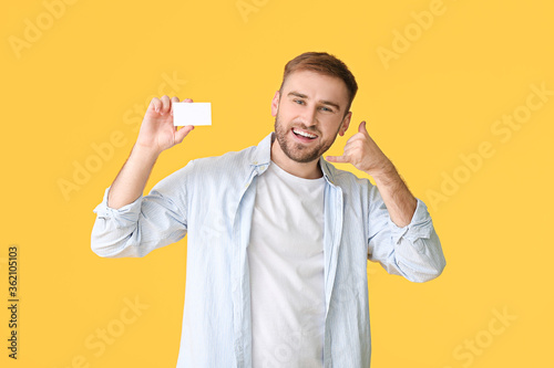 Young man with blank busine...