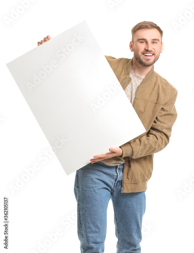 Young man with blank placar...